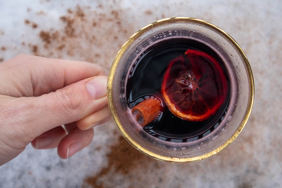 Spicebush mulled wine on snow with cinnamon sprinkle