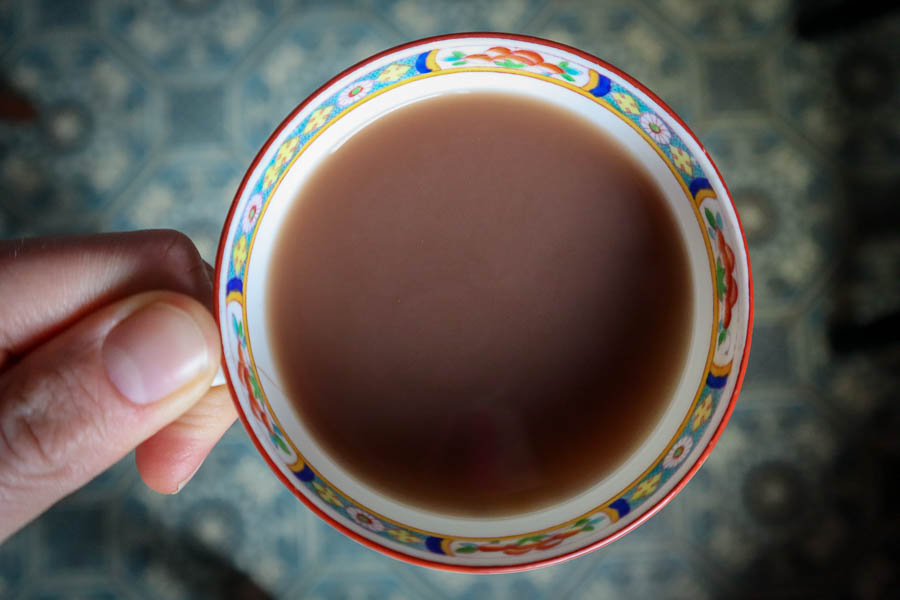 Maple sap masala chai on tile background