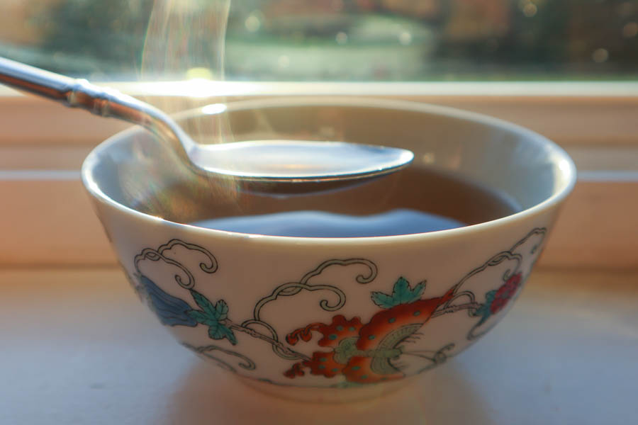 A steaming bowl of oyster mushroom broth with fennel